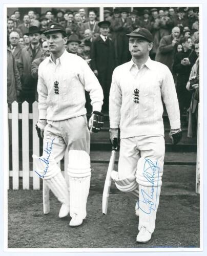 Len Hutton and Cyril Washbrook 1946/47. Excellent mono press photograph of the two players walking out to bat wearing England caps and sweaters, with the crowd in the background. Nicely signed in blue ink by both players. 8”x9.75”. Central Press Photos. V