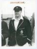 Warren Bardsley. New South Wales & Australia 1903-1926. Original mono press photograph of Bardsley standing half length wearing cricket attire, cap and blazer. Ink signature of Bardsley on piece laid to top edge. Various Australian press stamps to verso i