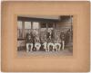 Lionel Charles Hamilton Palairet. Somerset & England. 1891-1909. Attractive sepia photograph of an unknown cricket team, standing and seated in rows, featuring Palairet seated to the middle of the group wearing striped blazer. The photograph, by Chaffin &