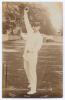 Arnold Warren. Derbyshire & England 1897-1920. Sepia real photograph postcard of Warren standing full length at the crease in bowling pose, wearing England cap. E. Hawkins & Co., Brighton. Postally unused. Slight mount indentations to corners and staining