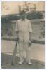 John Robert Freeman. Essex 1905-1928. Early sepia real photograph postcard of Freeman standing full length wearing cricket attire and Essex cap, leaning on a bat. Very nicely signed in ink to the photograph by Freeman. Blind embossed stamp to lower edge f