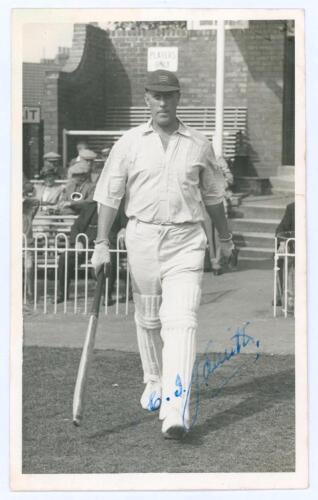 Cedric Ivan James ‘Jim’ Smith. Middlesex & England 1934-1939. Mono real photograph postcard depicting Smith full length walking out to bat from the pavilion at Scarborough, wearing Middlesex cap. Signed in blue ink to the photograph by Smith. Official sta