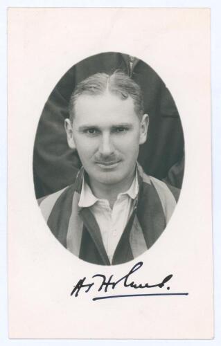 Albert John ‘Jack’ Holmes. Sussex 1922-1939. Original mono real photograph postcard of Holmes, head and shoulders in cameo, wearing striped blazer. Very nicely signed in black ink below the photograph by Holmes. Official stamp to verso for A. Wilkes & Son