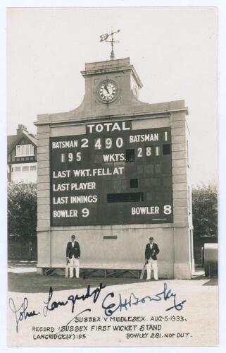 Sussex C.C.C. Record first wicket stand 1933. Mono real photograph postcard of John Langridge and Ted Bowley standing in front of the scoreboard at Hove for the match Sussex v Middlesex, 5th- 8th August 1933. The printed title describes the scoreboard sho
