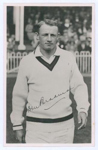 Don Bradman. Mono real photograph plain back postcard of Bradman depicted half length in cricket attire walking on to the field for the match H.D.G. Leveson-Gower’s XI v Australians at Scarborough 1948, with facsimile signature. Official stamp to verso fo