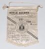 Edinburgh Athletic Club World Record 1974. Original silk hanging pennant with Club emblem to centre, printed title to top detailing the record ‘24 hr. 10 man by 1 mile relay at Meadowbank Stadium on 28th- 29th September 1974. Distance 297 miles 1146 yards