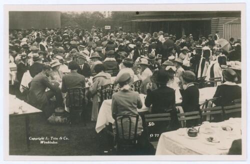 Wimbledon c.1912. Rare original mono real photograph postcard showing the many spectators enjoying lunch outdoors, long table clothed tables with waitresses serving, ladies in hats and men in boaters etc. Card no. 077 in a series issued by Edwin Trim & Co