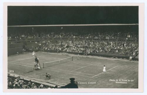 Wimbledon ‘Centre Court’ circa early 1930s. Original mono action real photograph postcard with a ladies singles match in progress. Card no. S73 in a series issued by Edwin Trim & Co. of Wimbledon, publishers name printed to lower corner. Postally unused. 