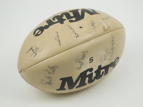 Barbarians and The All Blacks circa 1973. Mitre rugby ball signed by twenty one players from both teams. For the Barbarians: Dusty Hare, David Duckham, J.J. Williams, Ray Gravell, J.P.R. Williams, Charles Kent, Ian McGeechan, Peter Wheeler, Gerald Davies