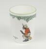 ‘Next Man In’. A Royal Doulton ‘Black Boy’ bone china Burke beaker, entitled ‘Next man in’ printed with a boy cricketer in red shirt, grey trousers and a floppy hat, sitting on his bat, waiting to go in, title ‘Next Man In’ to centre and to verso, the cre