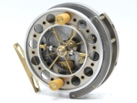 A scarce Dave Beale Twynham 4" centre pin reel, caged and six spoked drum with twin reverse tapered ivorine handle, ventilated flanges and twin release/regulator forks, B.P. line guide, pierced brass stancheon foot, rim mounted optional check lever with b