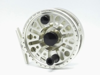 A good Tibor Everglades bonefish reel, gold anodised finish, slotted core drum with counter-balanced composition handle, block foot and rear milled spindle tension adjuster, backplate engraved with presentation details of a bonefish and "Largest Bonefish