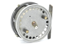 A scarce Hardy Triumph 3 ¼" bait casting reel, shallow cored drum with twin ebonite handles, jewelled spindle bearing and spring release latch, brass foot, rim mounted casting trigger, milled tension regulator and rear ivorine quadrant weight indicator a