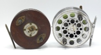 A Zephyr style 4" centre pin reel, mahogany faced alloy backed drum with twin horn handles and four screw spring release latch, brass strap back foot (filed) alloy backplate with sliding brass optional check button and a Harry Jackson 4" alloy centre pin