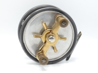A fine Hardy Fortuna 6" big game centre pin reel, reverse tapered twin ebonite handles on brass cross bar arm mounted above a six point capstan star drag, brass block foot, Andres patent anti-reverse drum mechanism, fixed click check mechanism, only very