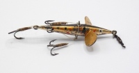A rare Gregory Excelsior Minnow bait, the 2" long white metal fish shaped lure with trout painted decoration, twin spinning vanes stamped maker and model details, twin side and one rear gut mounted flying treble hooks (one side hook loose), head box swiv