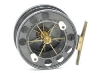 A good Allcock Aerial 4" model 950 T-6 centre pin reel, caged and six spoked drum with twin xylonite handles, perforated front flange (eight holes) and twin release/regulator forks, brass stancheon foot, rear sliding optional check button and bar spring 