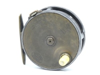A rare Hardy Brass Faced Perfect 3 1/8" trout fly reel, domed ivorine handle, brass foot, neatly tapered to both ends, strapped rim tension screw and early calliper spring check mechanism, contracted drum with four rim cusps and milled nickel silver lock