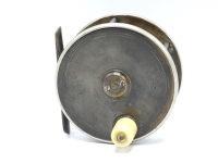 A Hardy brass and ebonite 3 ½" light salmon fly reel, domed ivorine handle, twin German silver rims, bridge foot, quadruple cage pillars, fixed check mechanism, faceplate with raised two screw spindle boss and stamped Rod in Hand trademark and enclosed o
