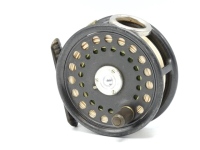A good Hardy St George 3" trout fly reel, ebonite handle, ribbed brass foot, three screw drum latch, white metal line guide, milled rim tension lever and Mk.II check mechanism, only very light wear to dark lead finish, 1940's
