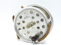 An unusual Hardy Improved Farne 5" variant sea centre pin reel, drum with ventilated front plate, reverse tapered ebonite single handle (advertised with twin handles) and nickel silver telephone drum latch, brass auxiliary rim pressure brake, brass block
