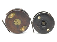 An early Nottingham 4" centre pin reel, ebonised wooden drum with twin turned bulbous bone handles and milled brass spindle locking disc, German silver bound rims, brass foot on iron strap support, no check, possibly by Wm. Dann and a Brailsford style 4 ½