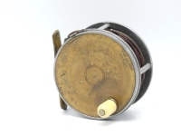 A scarce Hardy Brass Faced Perfect 3 ¼" light salmon fly reel, domed ivorine handle, pierced brass foot, strapped rim tension screw and early calliper spring check mechanism, drum with four rim cusps and milled nickel silver locking screw, faceplate stam