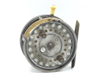 A Silex Major wide drummed 4 ¼" bait casting reel, shallow cored drum with twin ebonite handles, spring release latch and jewelled spindle bearing, ribbed brass foot, rim mounted brass auxiliary pressure brake and ivorine casting trigger, rear nickel sil