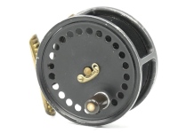 A Hardy No.4 Pattern Trade 3 ½" wide drummed light salmon fly reel, "wartime" black painted finish, drum with ebonite handle, single rod of perforations and nickel silver telephone drum latch, ribbed brass foot, milled rim tension screw and Mk.II check me