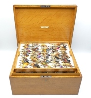 A fine C. Farlow & Co. Ltd. rectangular oak salmon fly reservoir, interior fitted six lift-out paper lined trays each fitted bars of nickel silver spring fly clips and holding a good selection of approximately 270 fully dressed salmon flies, including 15