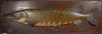 A rare Fochaber's carved wooden Pike, the naturalistically pained half block model with relief fins and mounted on stepped edge oak backboard, white painted legend "Pike, Caught Spinning by G.W. Pope, September 1897", backboard with (later) applied Hardy