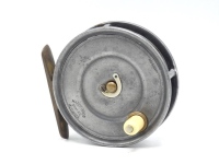 A Hardy Uniqua 3 3/8" trout fly reel, ivorine handle, brass foot, nickel silver horseshoe drum latch and fixed 1906 calliper spring check mechanism, faceplate stamped open oval and straight line logos, wear from normal use, circa 1908