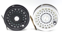 A Hardy Ultralite Disc Salmon and spare spool, black anodised finish, composition handle, two screw drum latch and rear milled spindle tension adjuster, in cloth pouch and a Marquis No.2 salmon fly reel and spare spool, ribbed brass foot, two screw sprin