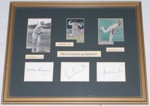 &lsquo;Three Great Leg-Spinners&rsquo;. One mono and two colour photographs of Richie Benaud (Australia), Anil Kumble (India) and Shane Warne (Australia) window mounted with good signatures on white card of each player mounted below. Framed and glazed, overall 17.5&rdquo;x