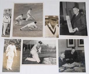 Bill Ponsford and Arthur Chipperfield. Australia. Seven original mono and sepia press photographs. Includes four of Ponsford, walking out to bat at Manchester 1930 (signed in later years by Ponsford), padding up in the nets wearing Victoria cap, and two c