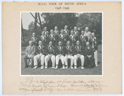 M.C.C. tour to South Africa 1948/49. Original mono photograph of the M.C.C. touring party, seated and standing in rows in cricket attire and tour blazers. The photograph laid down to mount with printed title to top border and very nicely signed in ink to 