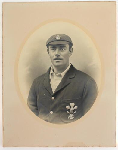 Albert Baker. Surrey 1900-1907. Large and very impressively striking early studio portrait of Baker half length wearing Surrey cap and blazer, both items showing the club emblem of the Prince of Wales feathers. The photograph, in cameo mount, by Lovell Sm