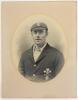 Albert Baker. Surrey 1900-1907. Large and very impressively striking early studio portrait of Baker half length wearing Surrey cap and blazer, both items showing the club emblem of the Prince of Wales feathers. The photograph, in cameo mount, by Lovell Sm