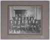 John Berry &lsquo;Jack&rsquo; Hobbs. Surrey & England 1905-1934. Original mono photograph of a group of twenty four gentlemen seated and standing in rows in formal and military attire. To the centre is Jack Hobbs wearing his Royal Flying Corps Uniform, dating the pho