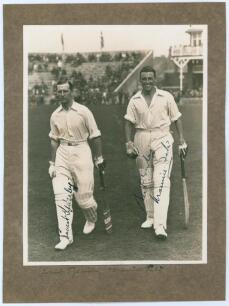 M.C.C. Australian Touring Team v C.I. Thornton&rsquo;s XI, Scarborough 1928. Original mono photograph of Ernest Tyldesley (Lancashire) and Maurice Tate (Sussex) walking out to bat for M.C.C. at Scarborough with crowds in the stands in the background, for the ma