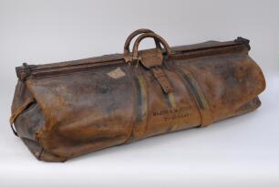 Major Robert Montagu Poore. Europeans, Hampshire & South Africa 1892-1906. Large heavy leather cricket bag used by Poore during his cricketing career playing for the 7th Hussars and presumably for Hampshire and other teams. The bag has central handles, is