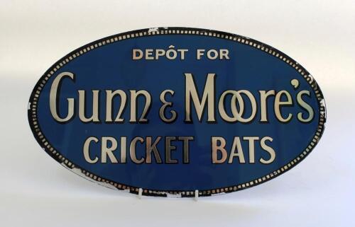 ‘Depot for Gunn & Moore’s Cricket Bats’ circa 1910/1920’s. Original glass oval advertising sign for Gunn & Moore bats. Mid blue background, mirrored finish silver lettering with black edging. silver and black decorative border, 13” wide. Some wear to bord