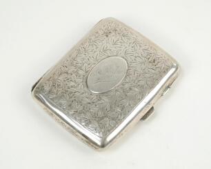 Errol Reginald Thorold Holmes, Surrey & England 1924-1955. Silver cigarette case presented to Holmes in 1949. The silver cigarette case, with machine floral decoration to exterior, has a raised plain oval plaque to centre engraved with inscription which r