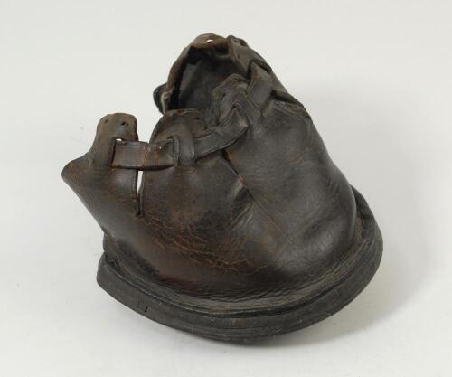 Horse shoe. Turn of the century leather shoe believed to have been worn by a horse whilst pulling the heavy roller on the wicket at Lord’s. The shoe with three spikes to sole, a little worn but still in good condition. An unusual item of memorabilia