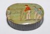 Cricket snuff box. A black lacquered papier mache oval snuff/pill box with hinged lid, believed to be circa 1870’s. The lid painted with a cricketing scene of boys playing cricket with trees in background. The box measures approx 2.75” x 2”x 1.25” deep. G