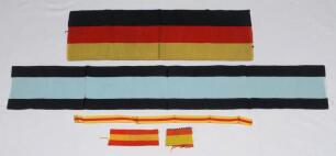 Club colours. Five fragments of cloth club colours of varying sizes. Colours are black and pale blue, possibly Cambridge University, 27.5”x4”, Black, red and yellow, possibly I Zingari, 16.5”x5’, and three smaller strips in the red and yellow ‘egg and bac