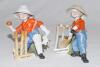 ‘How’s That’ and ‘The Hope of his Side’. Two Kinsella porcelain caricature spill vases of the young boy as a wicket-keeper and a batsman. Printed titles to base of the wicket on each. ‘Copyright’ stamp impressed to base. German, circa early 1900’s. Approx