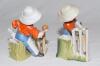 ‘How’s That’ and ‘The Hope of his Side’. Two Kinsella porcelain caricature spill vases of the young boy as a wicket-keeper and a batsman. Printed titles to base of the wicket on each. ‘Copyright’ stamp impressed to base. German, circa early 1900’s. Approx - 2