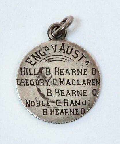 John Thomas ‘Jack’ Hearne. Middlesex & England 1888-1923. ‘Hat-trick. England v Australia, Headingley 1899’. Small silver metal medal presumably given to Hearne following his record achievement. The medal is inscribed ‘Eng v Aust. Hill. B. Hearne 0, Grego