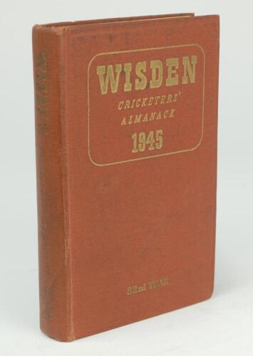 Wisden Cricketers’ Almanack 1945. 82nd edition. Original hardback. Only 1500 hardback copies were printed in this war year. Minor dulling to gilt titles on the spine paper, slight wrinkling to spine paper, inscription handwritten to first advertising page